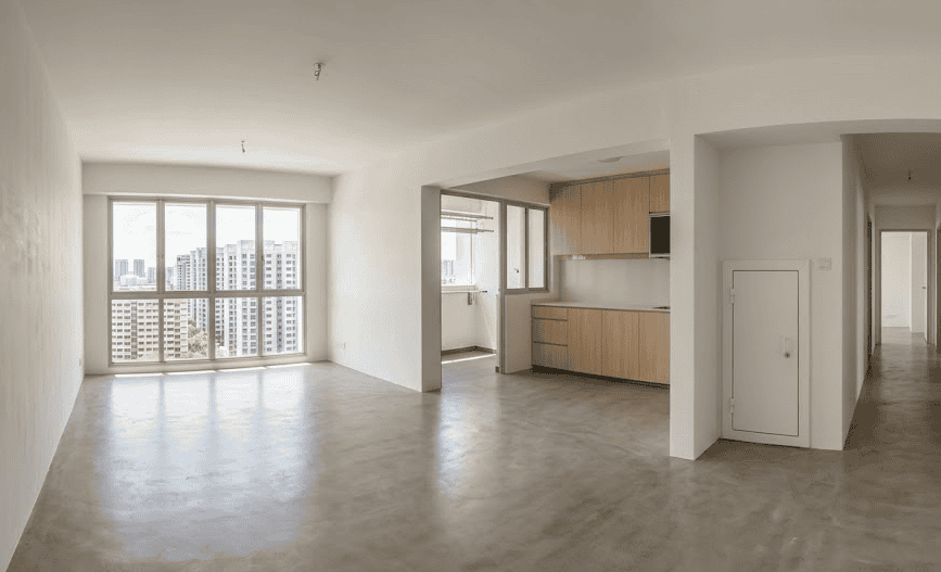 Spacious empty 4-room HDB flat with large windows and open-plan kitchen in Singapore.